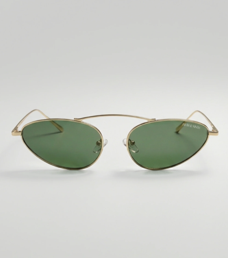 Gold-framed sunglasses with green lenses on a white background