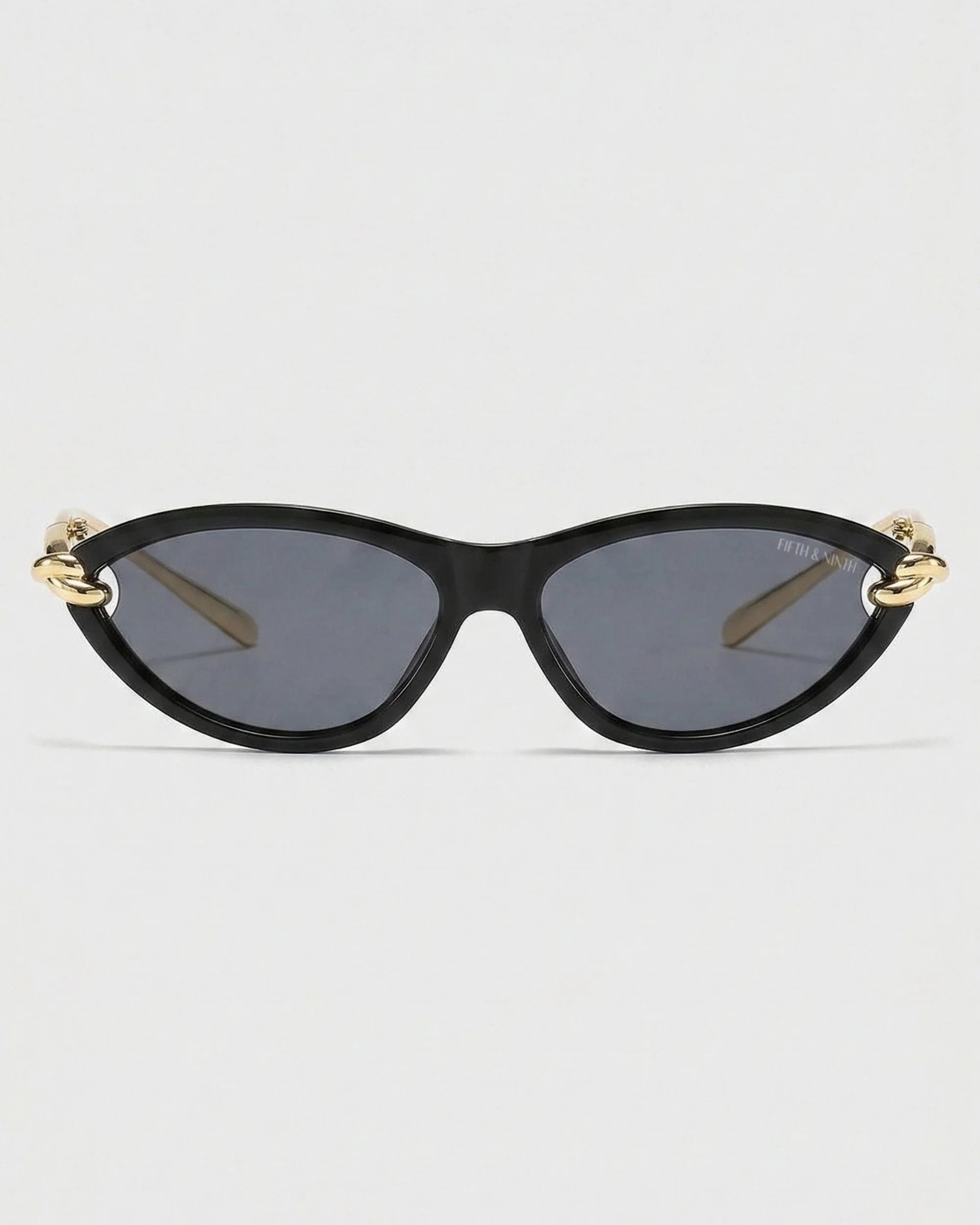 Black Saskia polarized cat-eye sunglasses with gold curved temple accents and dark lenses
