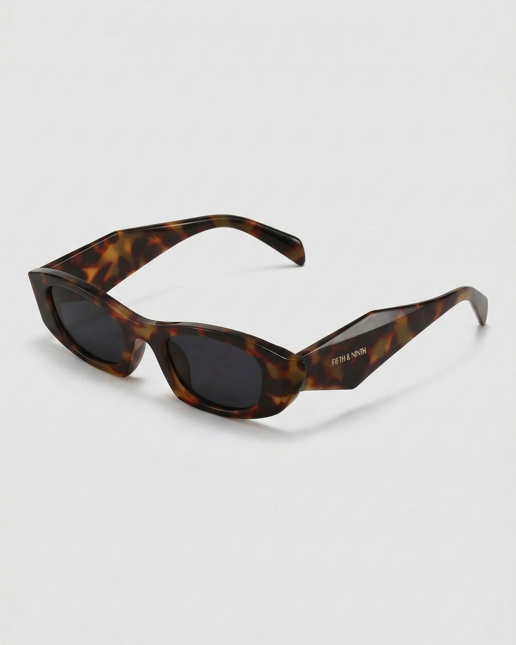 Modern tortoise oval sunglasses with low-profile geometric design and polarized lenses