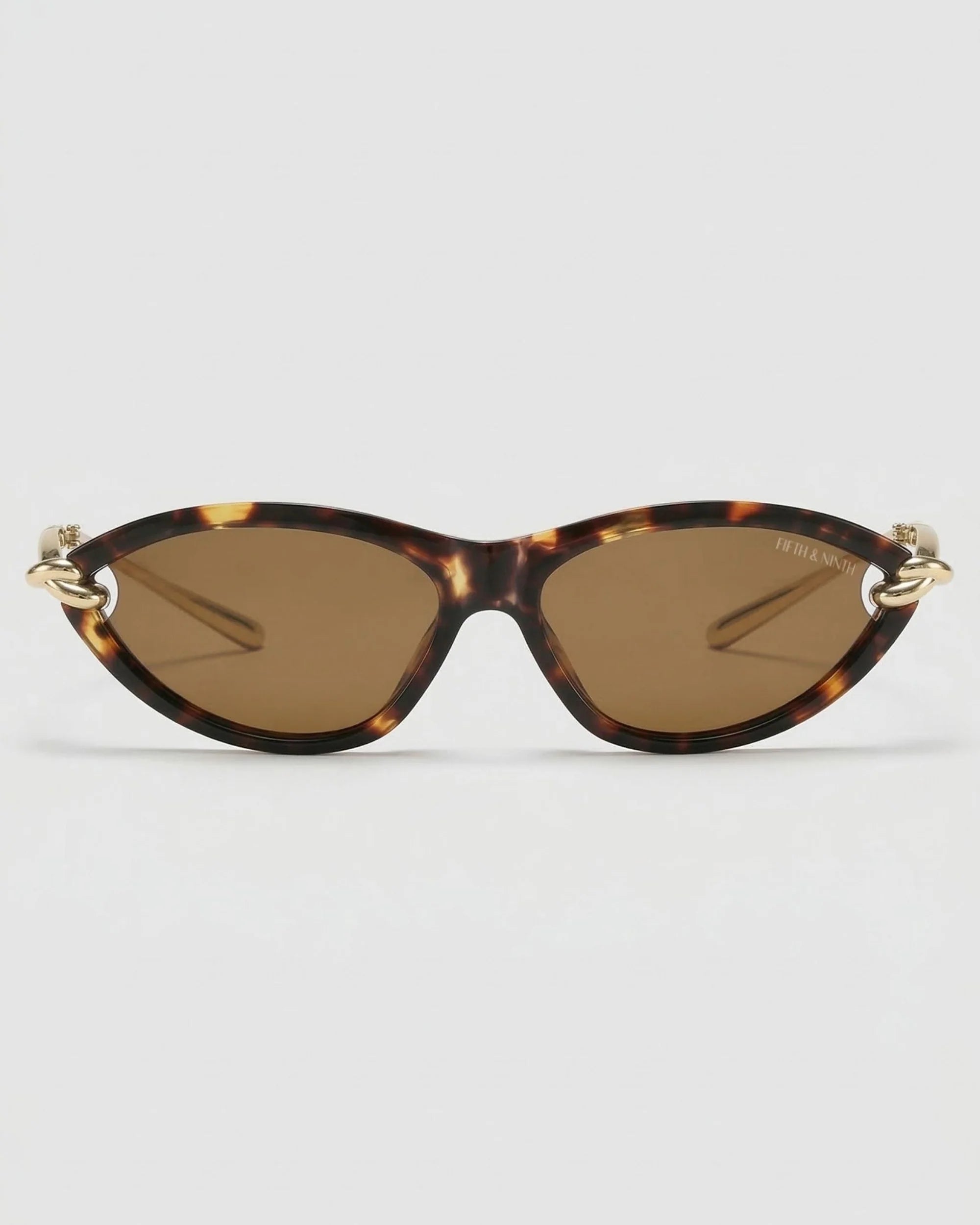 Saskia polarized cat-eye sunglasses with tortoise frame, brown lenses, and gold curved temple accents