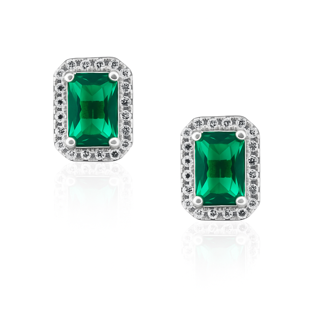 Silver and a pair of emerald green square gemstone earrings with diamond-like white stones on a white background